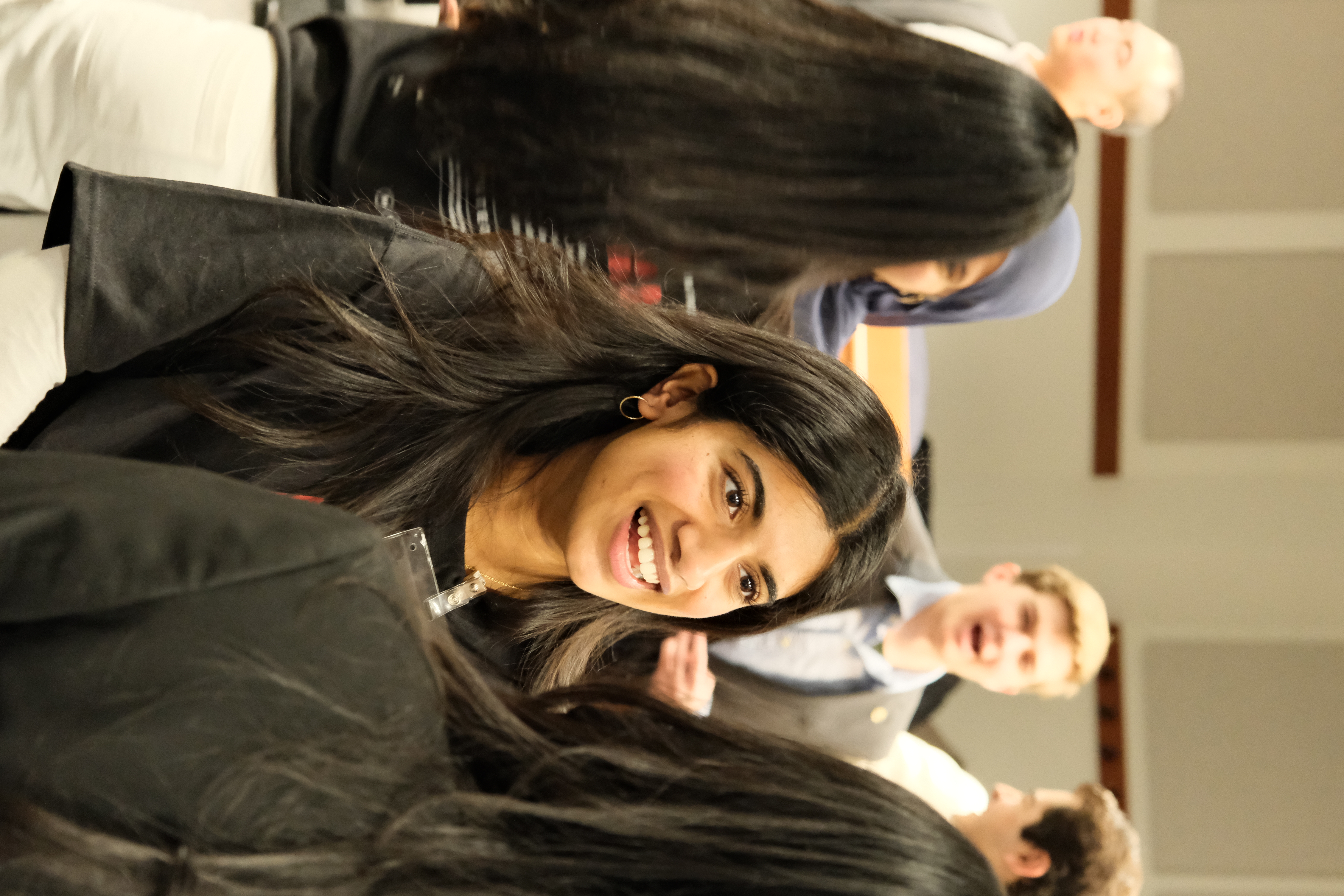 Gamma Upsilon members at an info session during rush